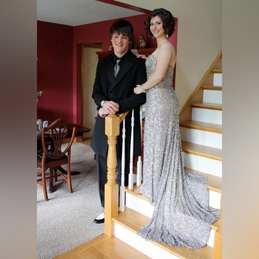 100% Silk and sequins with side slit and small train. Size 8. Worn once.